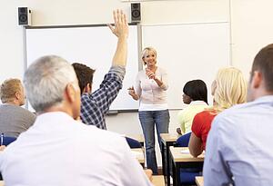 Senior tutor teaching class