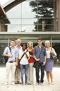 Mixed group of students outside college