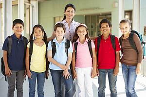 Pre teen schoolchildren with teacher