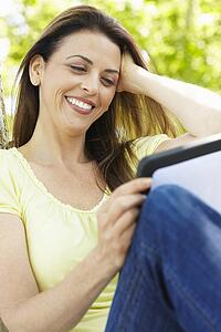 Woman using tablet outdoors