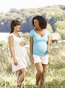 Pregnant women outdoors in countryside