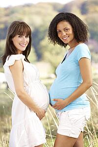 Pregnant women outdoors in countryside