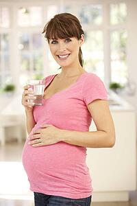 Pregnant woman drinking water