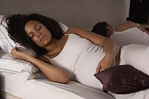 Pregnant woman trying to sleep