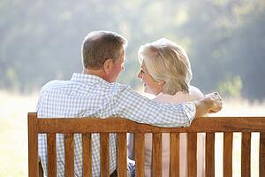 Senior couple sitting outdoors
