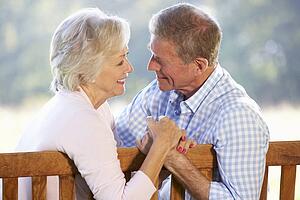 Senior couple sitting outdoors
