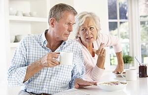 Retired couple arguing at breakfast