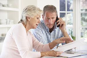 Retired couple with household bills