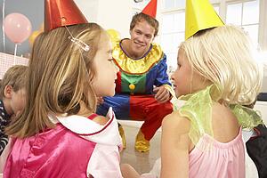 Clown entertaining children at party