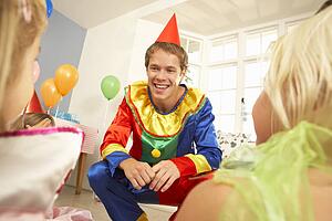 Clown entertaining children at party