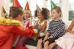 Clown entertaining children at party