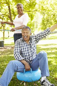 Senior couple playing with children's toys
