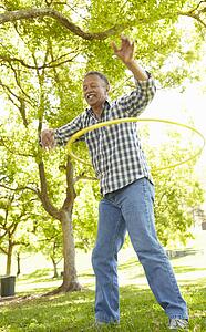 Senior man with hula-hoop