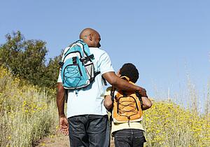 Father and son on country hike