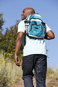 Young man on country hike