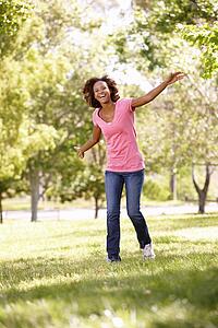 Young woman running in park