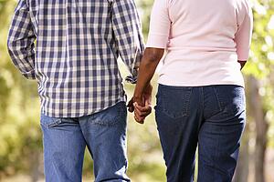 Senior couple walking in park