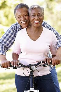 Senior couple cycling in park