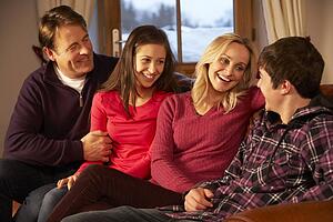 Portrait Of Family Relaxing On Sofa Together