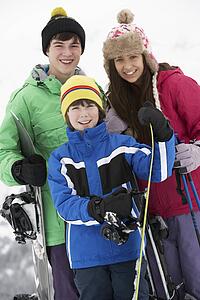 Group Of Children On Ski Holiday In Mountains