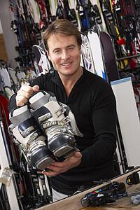 Sales Assistant With Ski Boots In Hire Shop