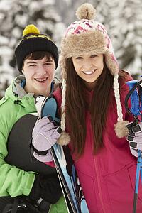 Two Teenagers On Ski Holiday In Mountains