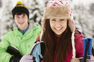 Two Teenagers On Ski Holiday In Mountains