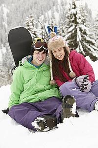 Two Teenagers On Ski Holiday In Mountains