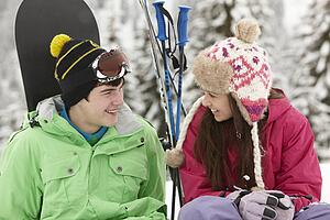Two Teenagers On Ski Holiday In Mountains