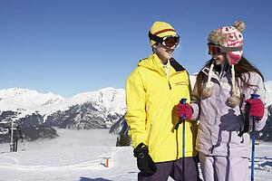 Two Teenagers On Ski Holiday In Mountains