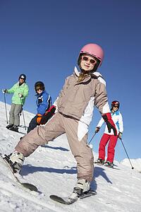Family On Ski Holiday In Mountains