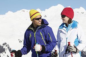 Couple Having Fun On Ski Holiday In Mountains