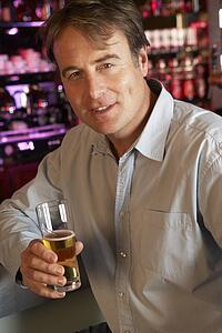 Man Enjoying Drink At Bar