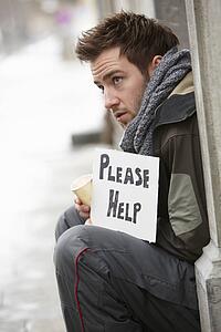 Homeless Young Man Begging In Street