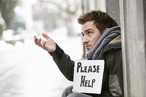 Homeless Young Man Begging In Street