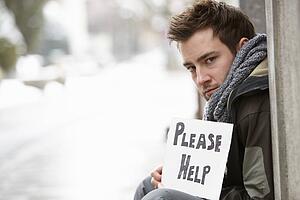 Homeless Young Man Begging In Street