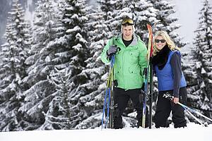 Young Couple On Ski Holiday In Mountains