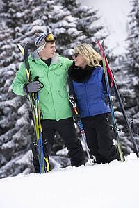 Young Couple On Ski Holiday In Mountains